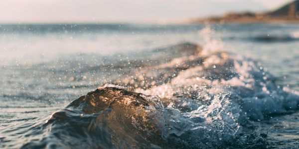 small wave breaking at the shore